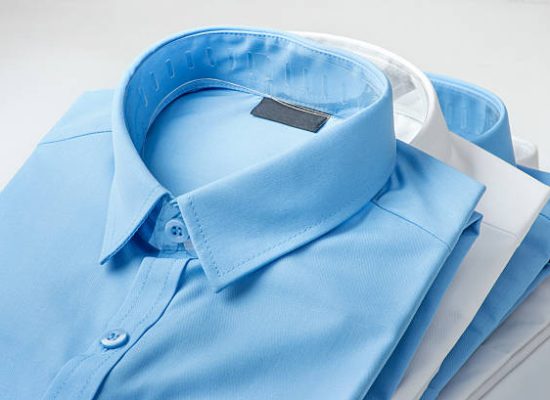 Stack of blue and white shirt closeup